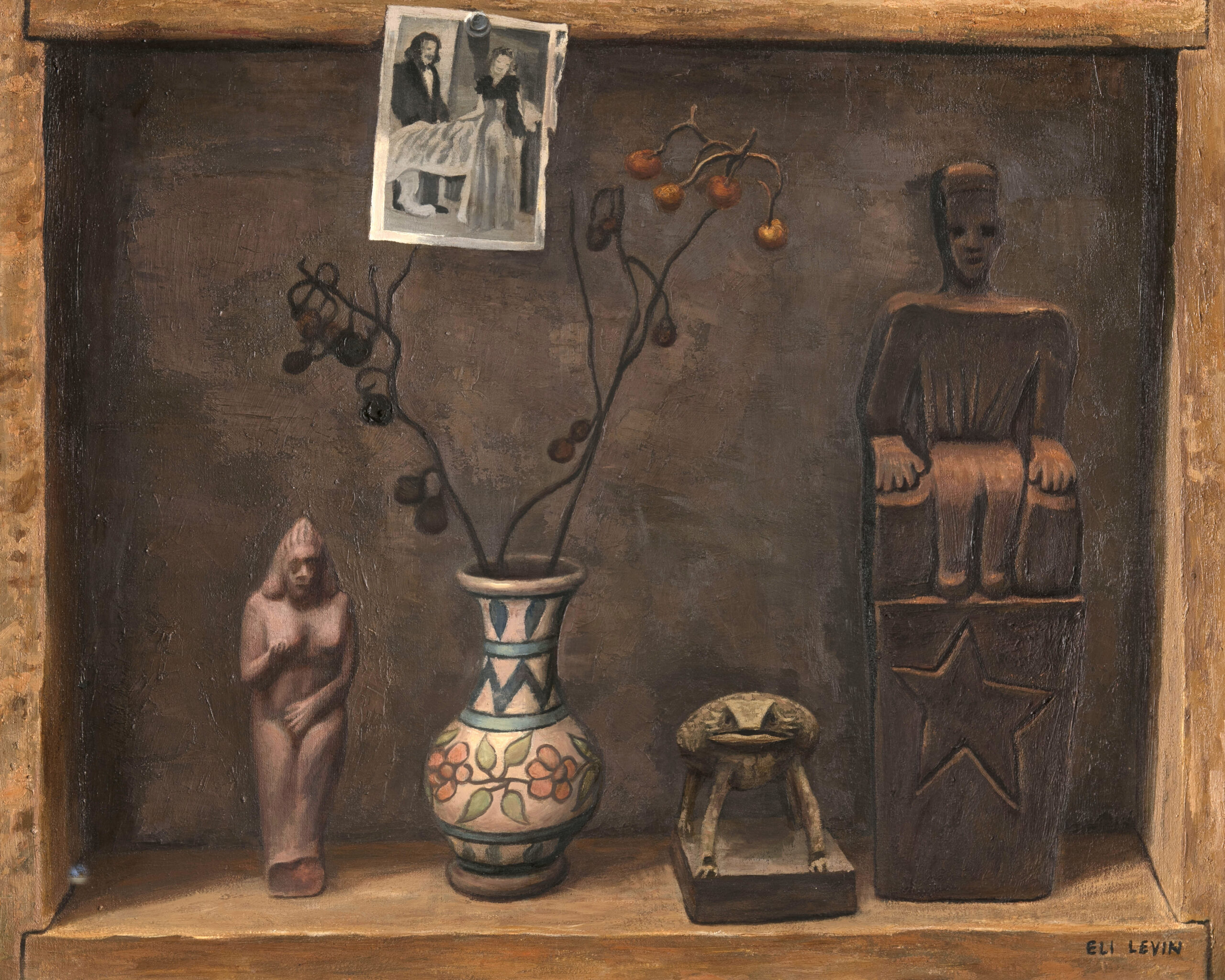 A darkened still life of rich earth tones shows off a small collection arranged on a shelf, recessed into the picture plane. The objects on the shelf are (from left to right) an ancient clay figure of a woman, a blue and white vase with dried flowers, a taxidermy horned toad, and a woodcarving depicting a seated figure. Above these objects, a black and white photo of a man and woman is painted as though attached to the top edge of the recess.